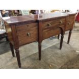 A nineteenth century breakfront mahogany sideboard, the top inlaid with boxwood & ebony stringing,