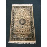 A silk style oriental rug woven with central circular medallion and multi-floral designs on pink