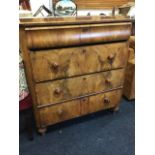 A nineteenth century European mahogany chest of drawers, the rounded moulded top above a cushion