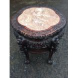 A Chinese jardinière table, the circular scalloped top inset with marble panel framed by blind