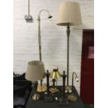A brass tablelamp modelled as an Oriental Express oil lamp with adjustable shade; a pair of