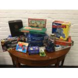 A collection of board games and jigsaws, some unopened - Scrabble, Blow Football, Murder Mystery
