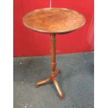 A nineteenth century mahogany circular tray-top occasional table, the single piece top on later