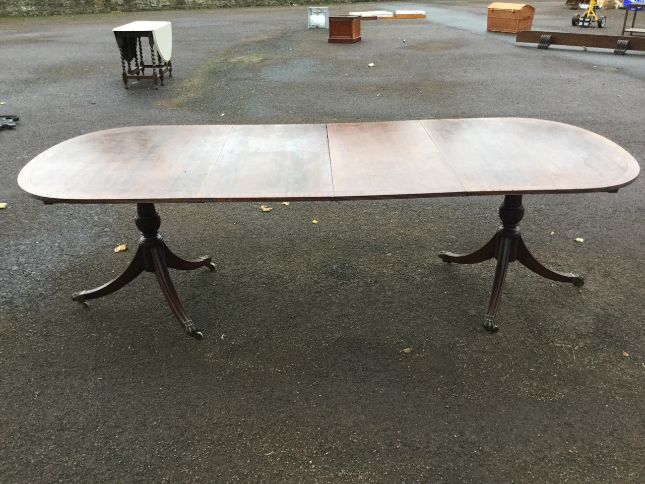 A Georgian style mahogany twin pedestal dining table, the crossbanded top with ebony stringing - Image 3 of 3