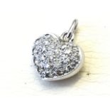 A white gold diamond pendant, the heart shaped drop pave set with panel of diamonds of half a carat,