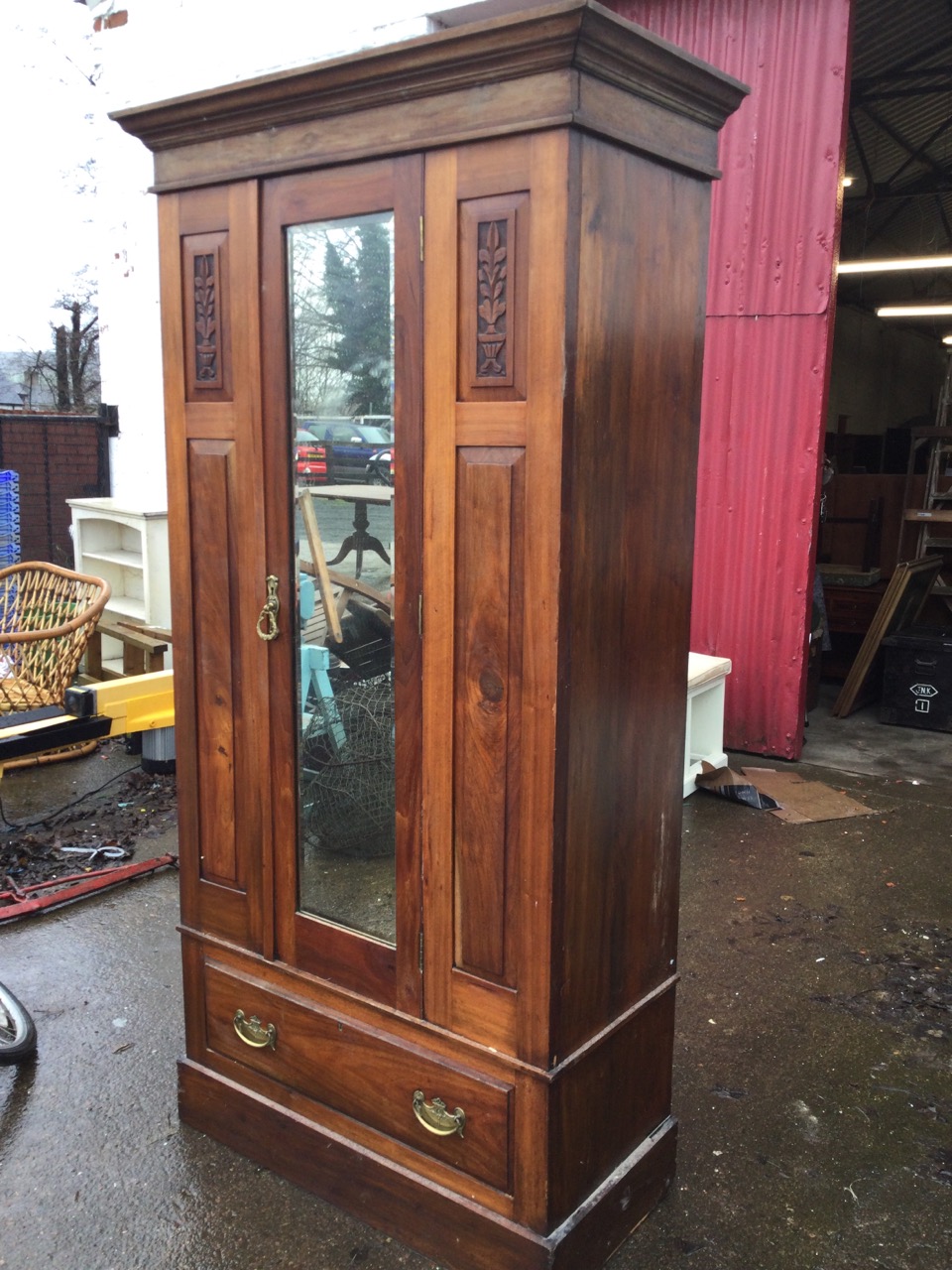 A Victorian walnut wardrobe with moulded cornice above a central bevelled mirror door flanked by - Image 2 of 3