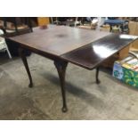A mahogany draw-leaf dining table, the panelled top raised on cabriole legs with pad feet. (35.5in x