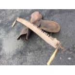 A leather saddle; and a two-man 5ft antique log saw with elm handles. (2)