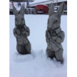 A pair of composition stone Beatrix Potter/Alice in Wonderland type rabbits, the beasts in jackets