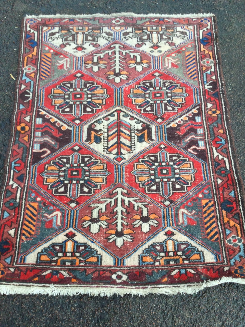 A Turkish rug woven with grid of hexagonal floral panels framed by a border of serrated linked - Image 2 of 3