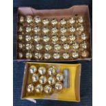 51 English made brass door handles, the knobs with screw plates, complete with a quantity of
