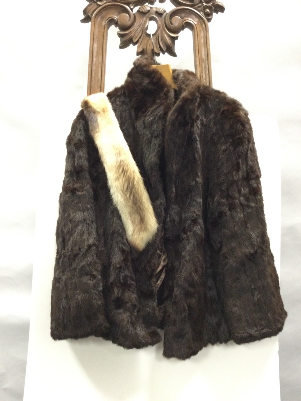 A lined mink fur coat with hook and eye fastenings, pockets, wide collar - size 12/14; and a fox fur