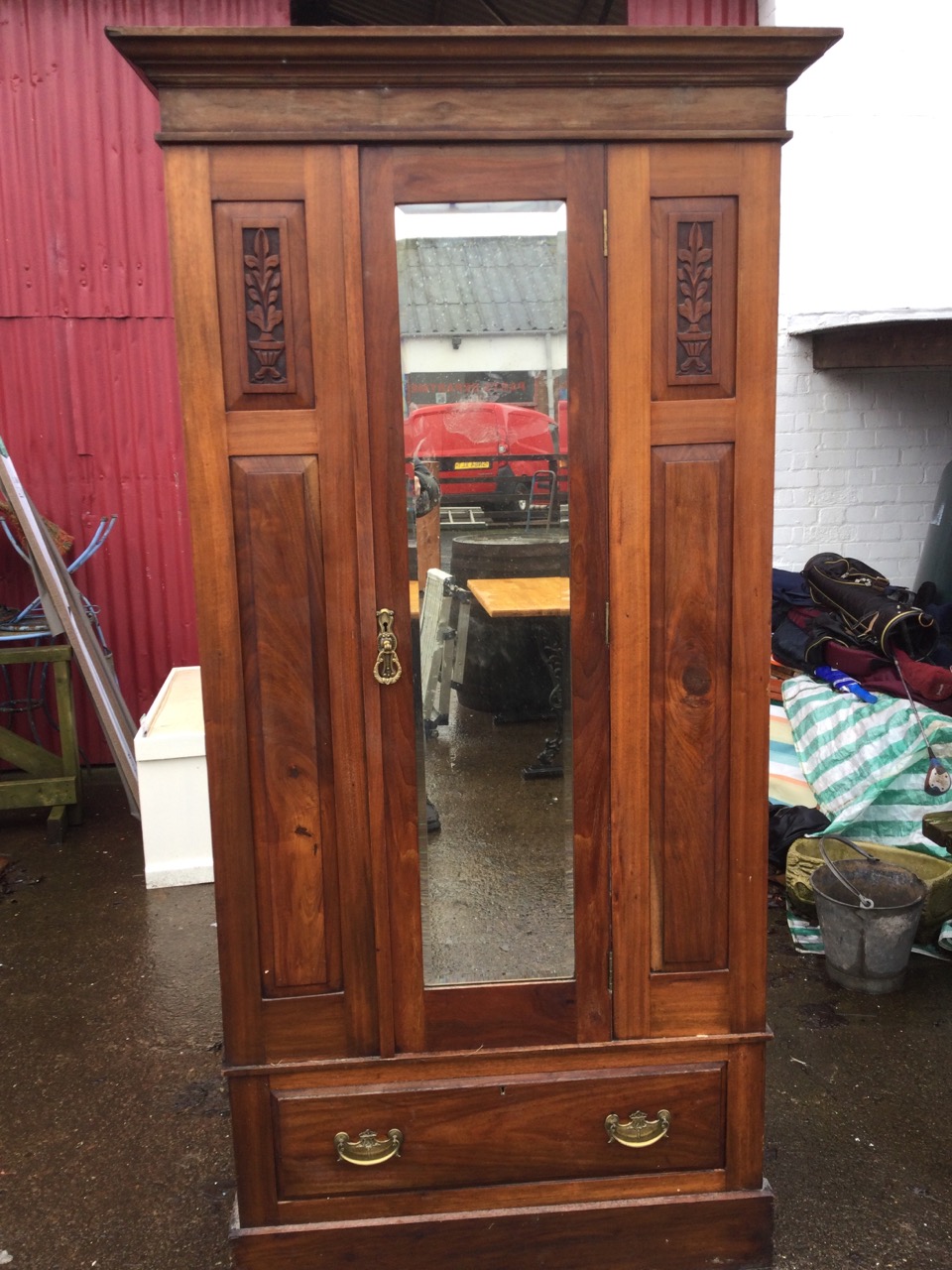 A Victorian walnut wardrobe with moulded cornice above a central bevelled mirror door flanked by - Image 3 of 3