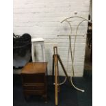 A walnut sewing cabinet with hinged lid and two drawers below, a painted square jardiniere stand;