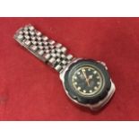 A 70s ladies Tag Heuer watch, the stainless case with tyre bezel having date aperture - professional