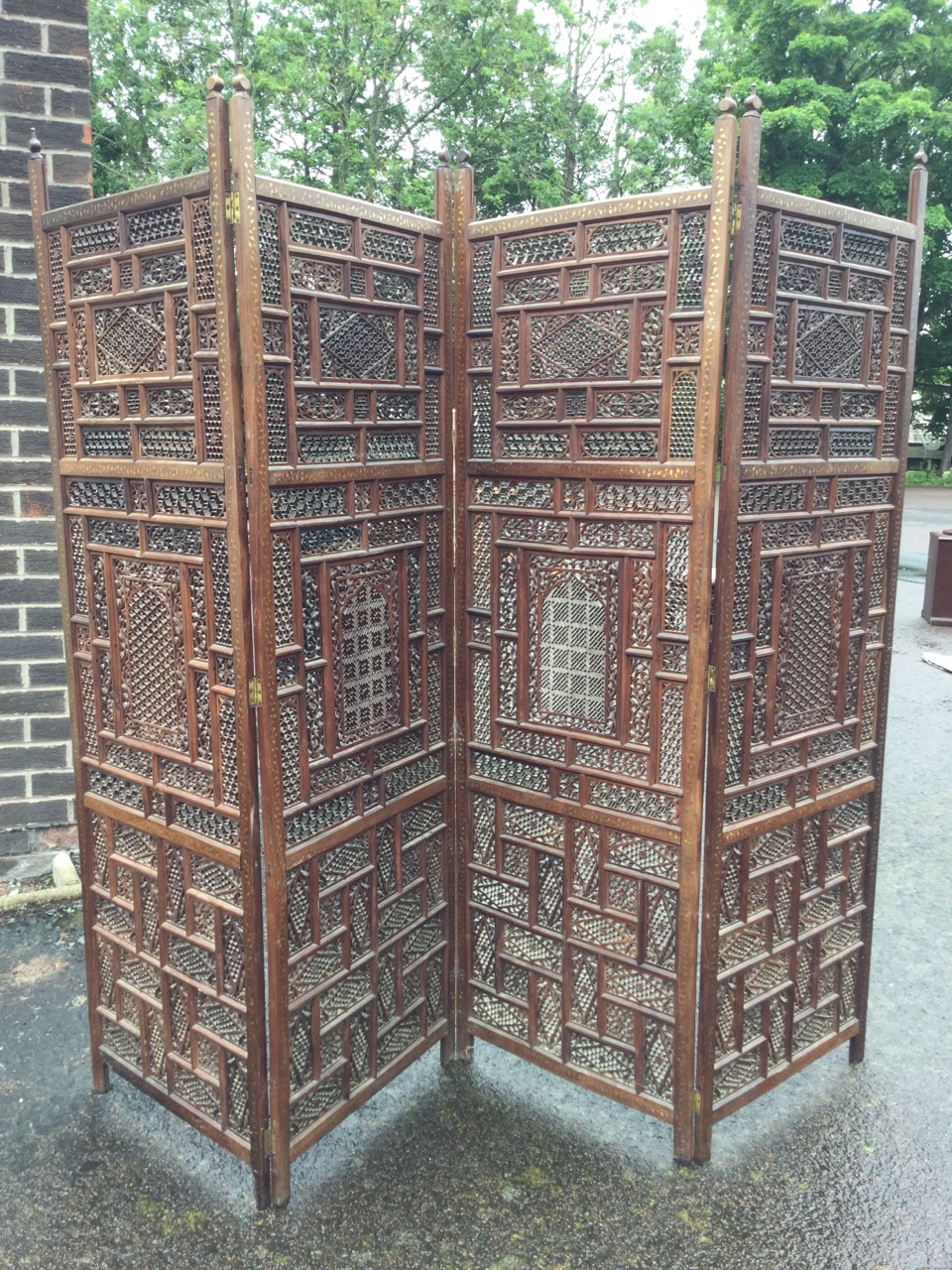 A four-fold oriental carved hardwood screen, with pierced fretwork panels in frames inlaid with - Image 3 of 3
