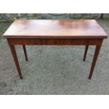 A nineteenth century mahogany turn-over-top tea table, the two leaves with rounded moulded edges