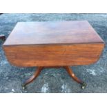 A nineteenth century mahogany sofa table, the rectangular moulded top with D-shaped drop leaves