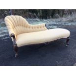 A Victorian mahogany chaise, the fluted button upholstered shaped back with scroll carved supports