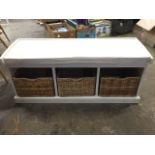 A contemporary hall storage bench, the white painted seat, having three compartments with baskets,