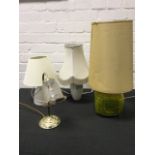 A mottled glazed ceramic tablelamp with tall shade; a vase tablelamp with swagged decoration; a