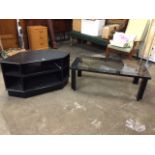 An ebonised television stand with pull out shelf, and an ebonised coffee table with plate glass top.