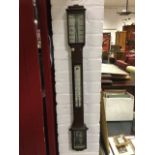 A nineteenth century mahogany stick barometer by N Gardner of Glasgow, with moulded cornice above