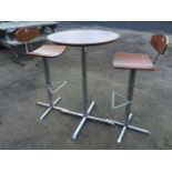 A contemporary Italian walnut & chrome pedestal table & two chairs, the circular table on column,