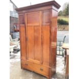 A late Victorian mahogany wardrobe with moulded cornice above a moulded panelled front with