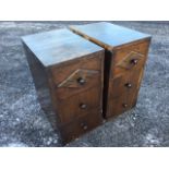 A pair of oak cabinets, each with three drawers, the top drawers with applied diamond shaped