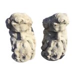 A pair of composite stone garden seats, modelled as bearded mythological heads. (30in) (2)