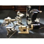 Four miscellaneous electrical optical instruments on adjustable stands by Magnon, American