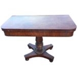A George IV mahogany turn-over-top tea table, the rounded twin top supported on a twisted and turned