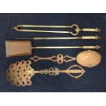 A set of three brass fire irons with square shafts & handles with ball finials - tongs, poker &