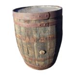 An oak whiskey barrel, the staithes bound by four riveted metal strap bands. (34.5in)