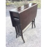 A stained Edwardian sutherland table, the rectangular top with canted drop leaves supported on