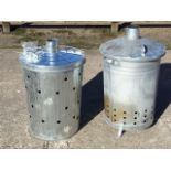 Two braziers with perforated ribbed bins, the covers with tubular chimneys - one unused. (2)