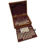 An oak cased silver dessert set, the twelve knives & forks with gadroon moulded handles - Sheffield,