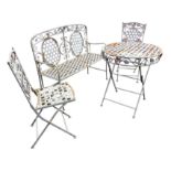 A painted folding garden table & chair set, decorated with wrought iron flowers and leaves framing