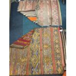 An oriental kilim bag woven with hooked diamond bands on madder ground with striped back; and