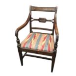 A nineteenth century mahogany elbow chair, the back with moulded tablet rail above a fluted