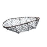 A set of six oval wirework baskets, the frames having hand-holes to ends. (23in x 16.5in x 8in)