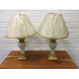 A pair of tablelamps with painted octaganol and gilded vase shaped bases, mounted with parchment