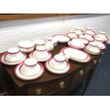 A Victorian twelve-piece Staffordshire teaset with ribbed bodies, having red & gilt borders. (A