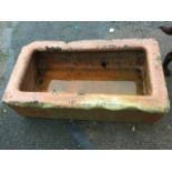 A rectangular Victorian salt glazed stoneware trough with flat moulded rim - cracked. (35.5in)