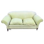 A drop-arm "country house" sofa, with padded back and arms above loose cushions with sprung seat,