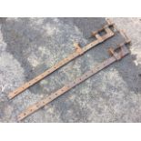 A near pair of cast iron sash cramps. (54in) (2)