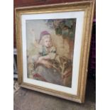 A large Victorian needlework panel of a girl playing with her dog, mounted and in moulded gilt &