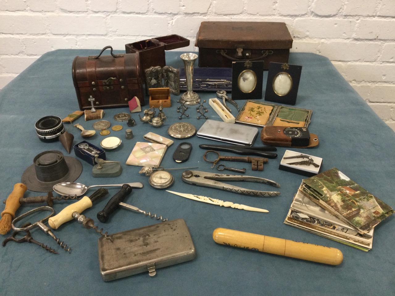 Miscellaneous items including treen, a hallmarked silver frame, a miniature bible, a sewing case,