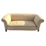 A three-seater Chesterfield drop-arm sofa with padded back and sprung seat, upholstered in lemon
